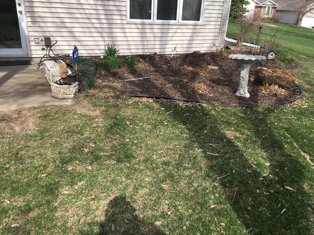A vibrant green yard stretches beside the home.