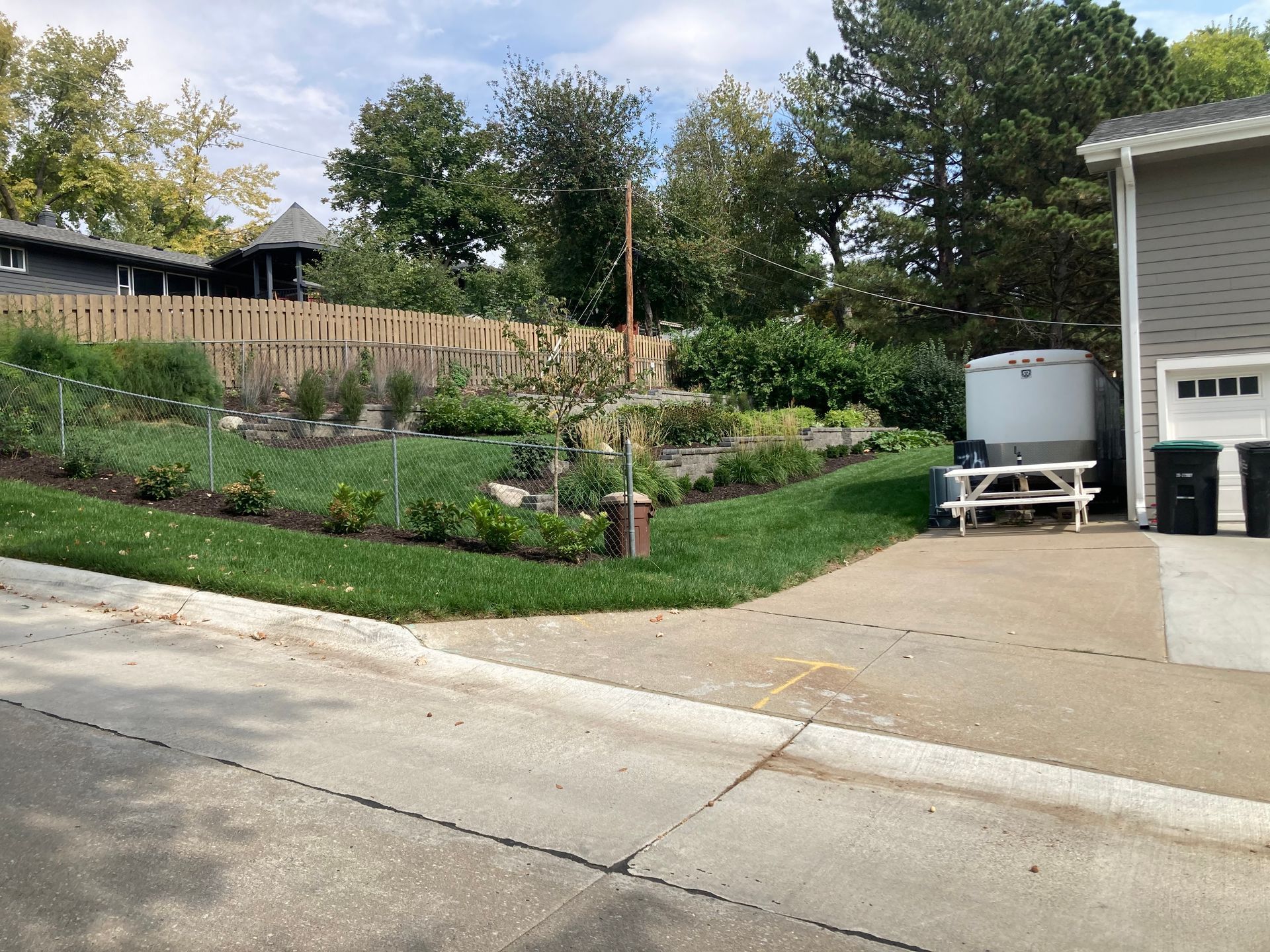 a house with a picnic table in front of it