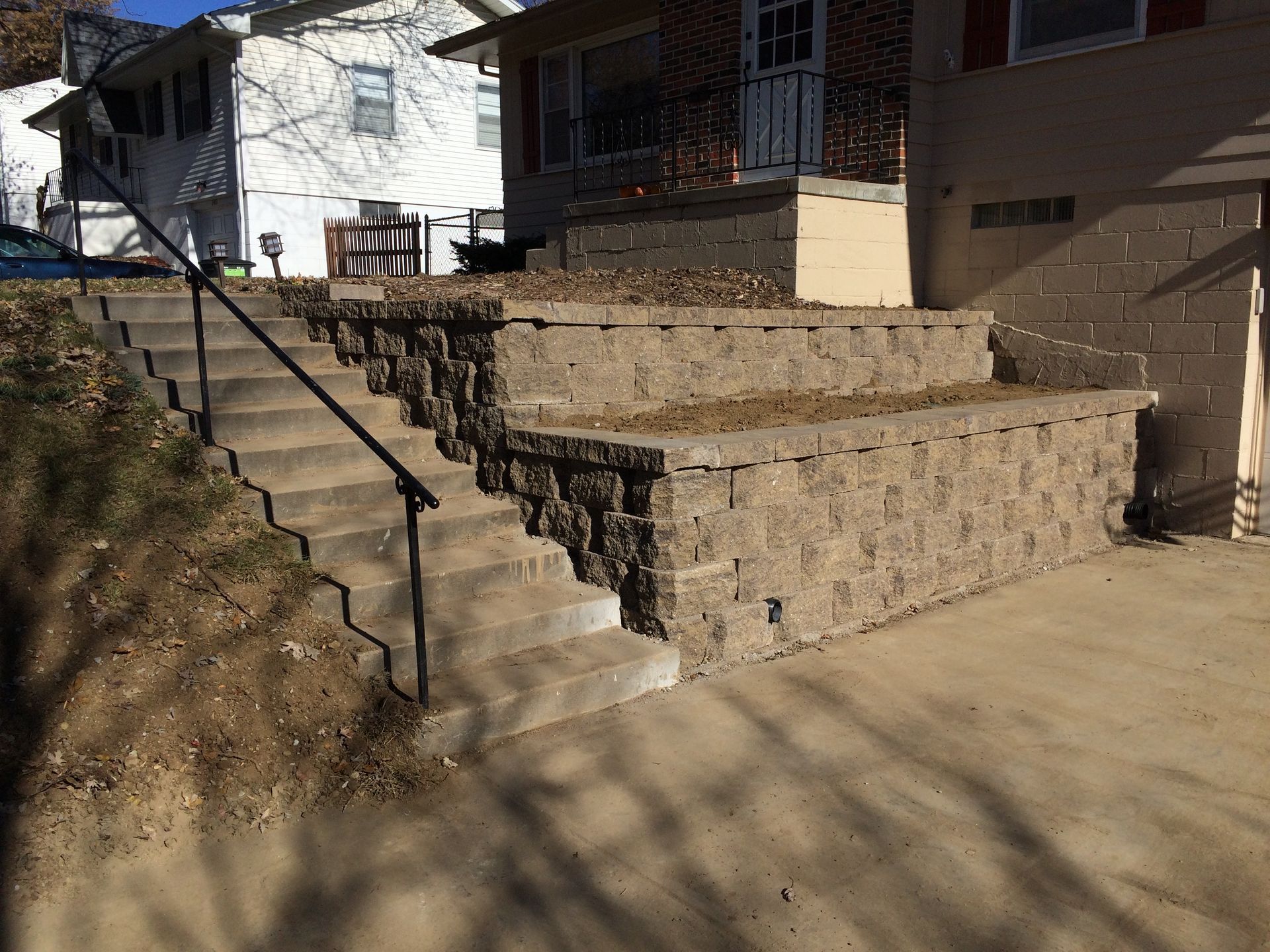 a set of stairs leading up to a house with a railing