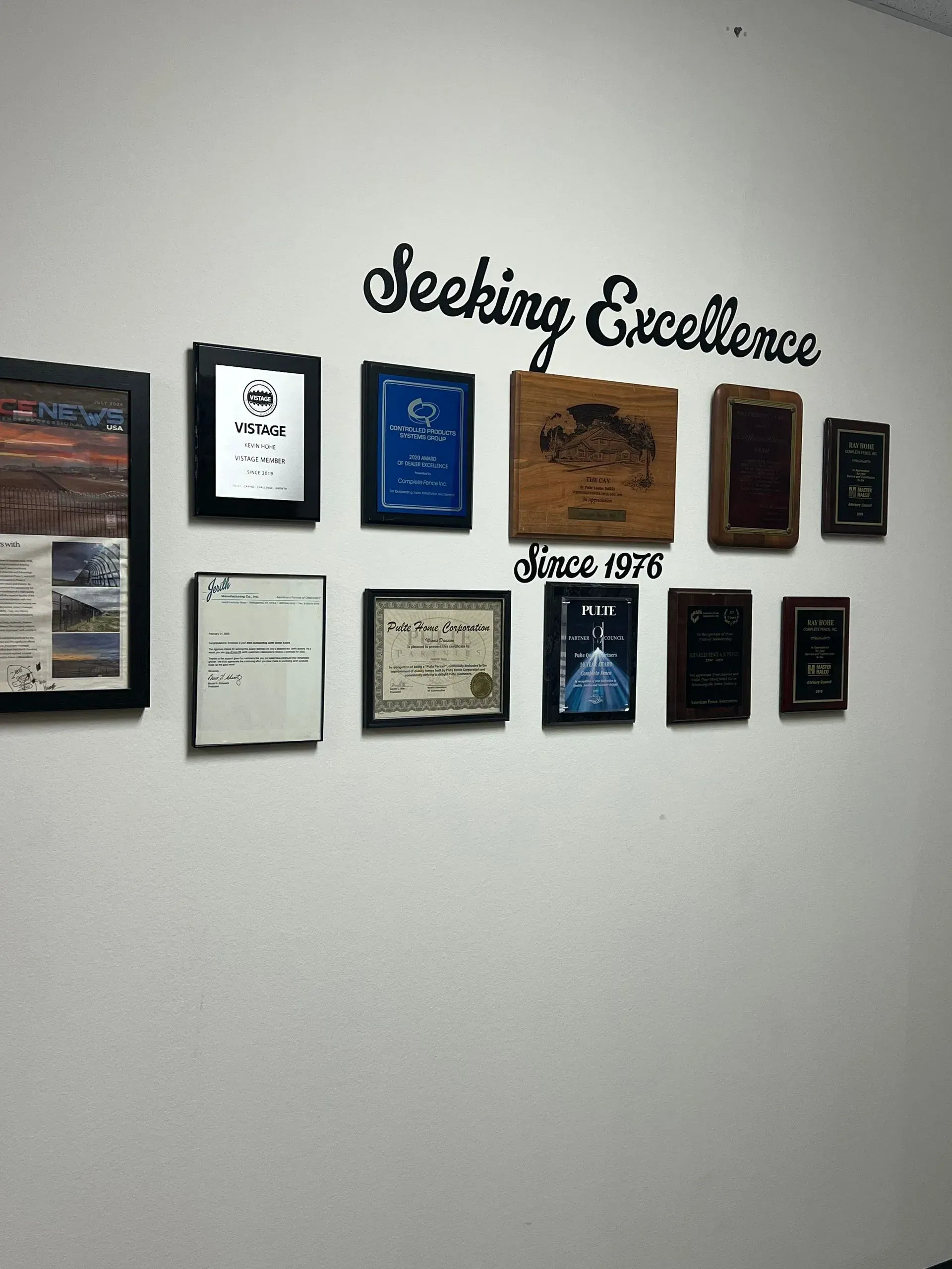 Wall display with framed documents and 