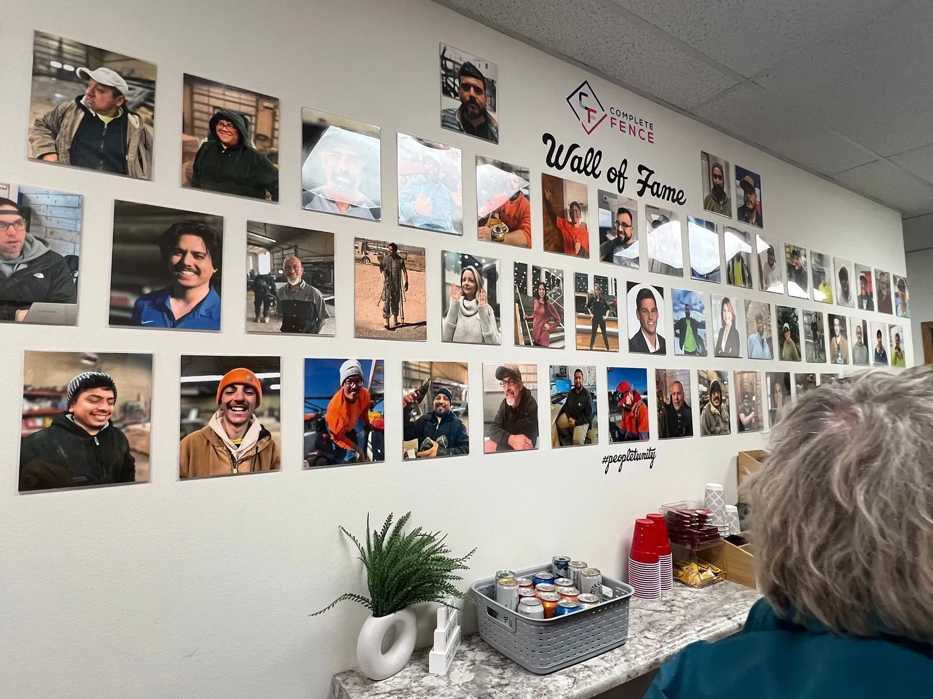 A wall with many framed photos; 