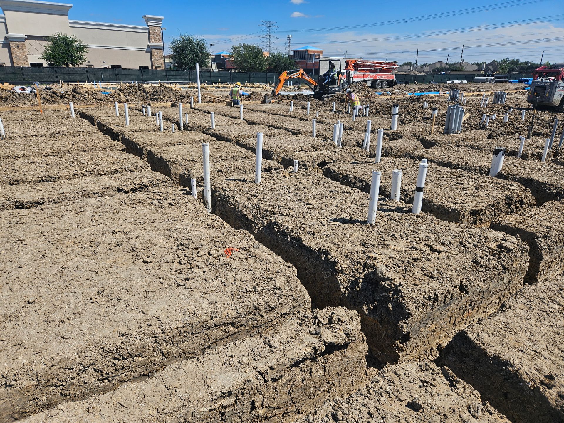 An aerial view of a building under construction with a lot of wooden frames.