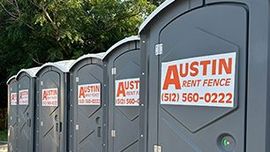 Portable toilets lined up in a row