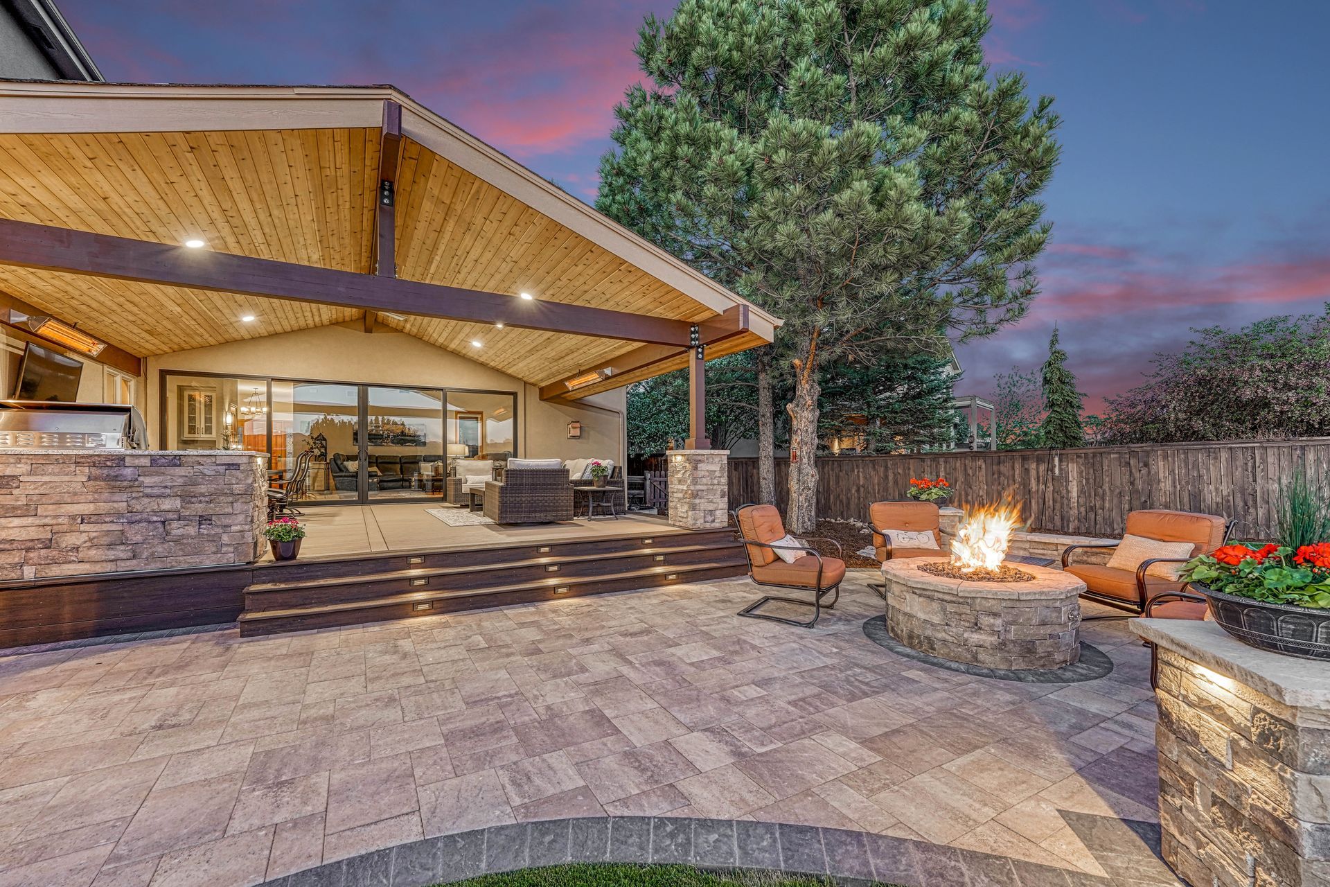 a fire pit in the middle of the patio