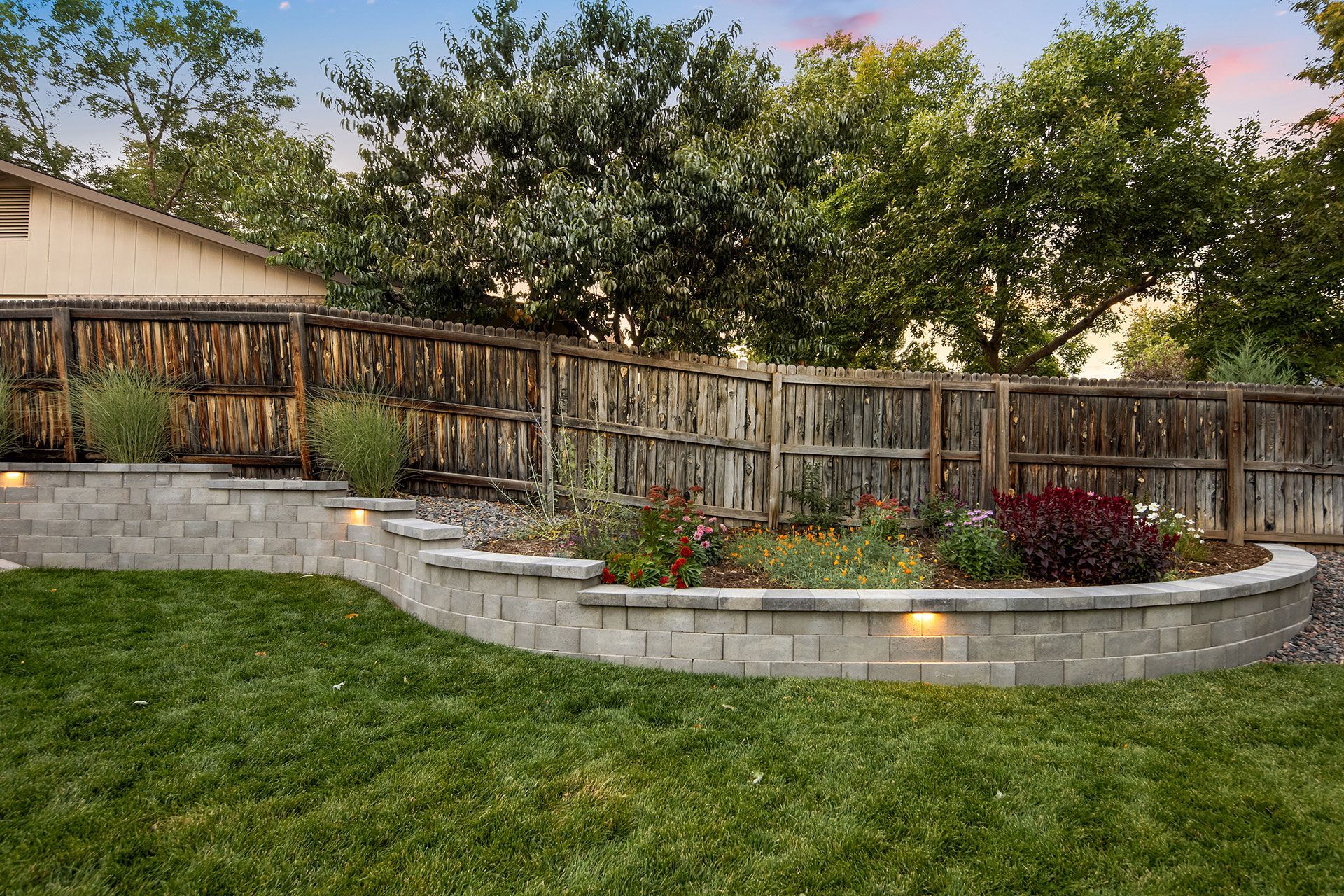 backyard landscape with fence