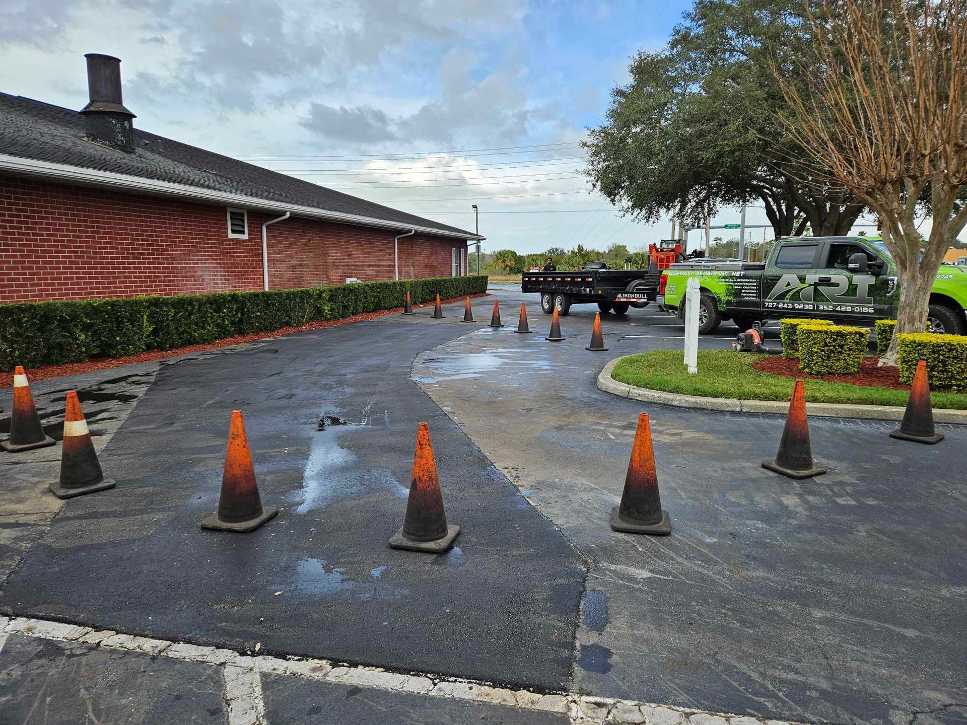 A lot of traffic cones are in the parking lot