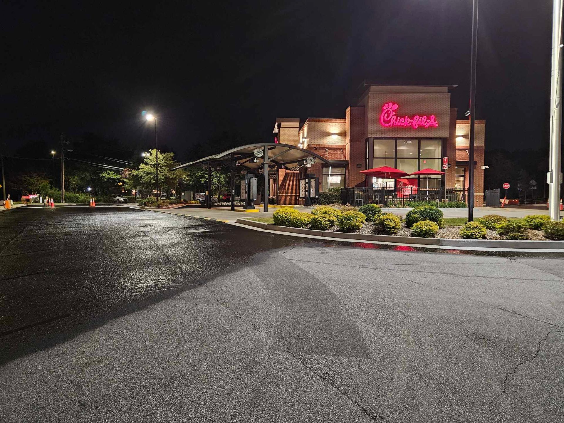 A chick-fil-a restaurant is lit up 