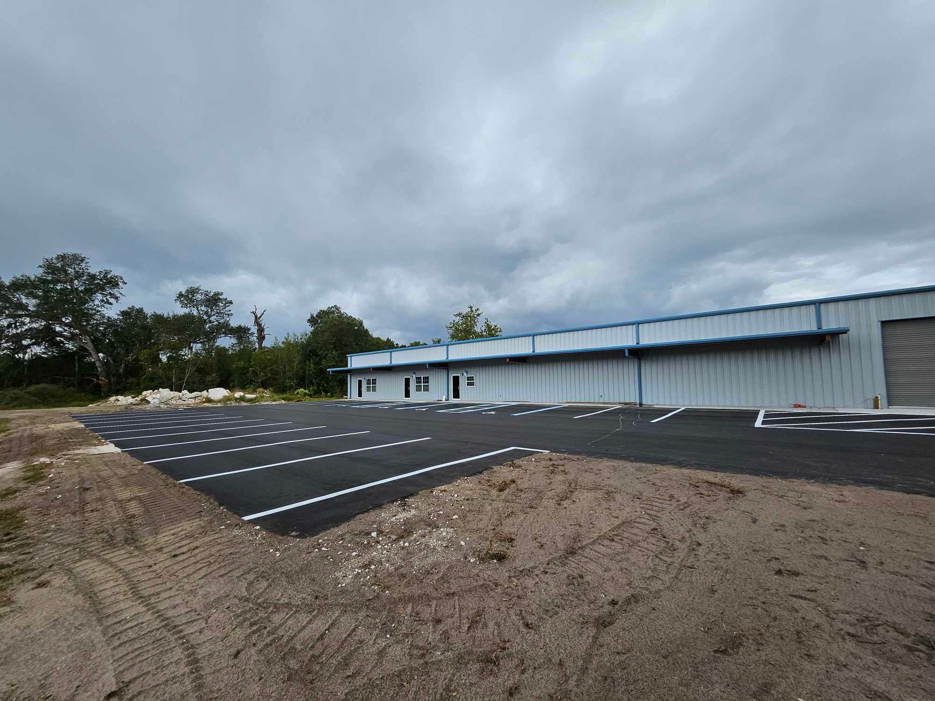 A large building with a lot of parking spaces in front of it