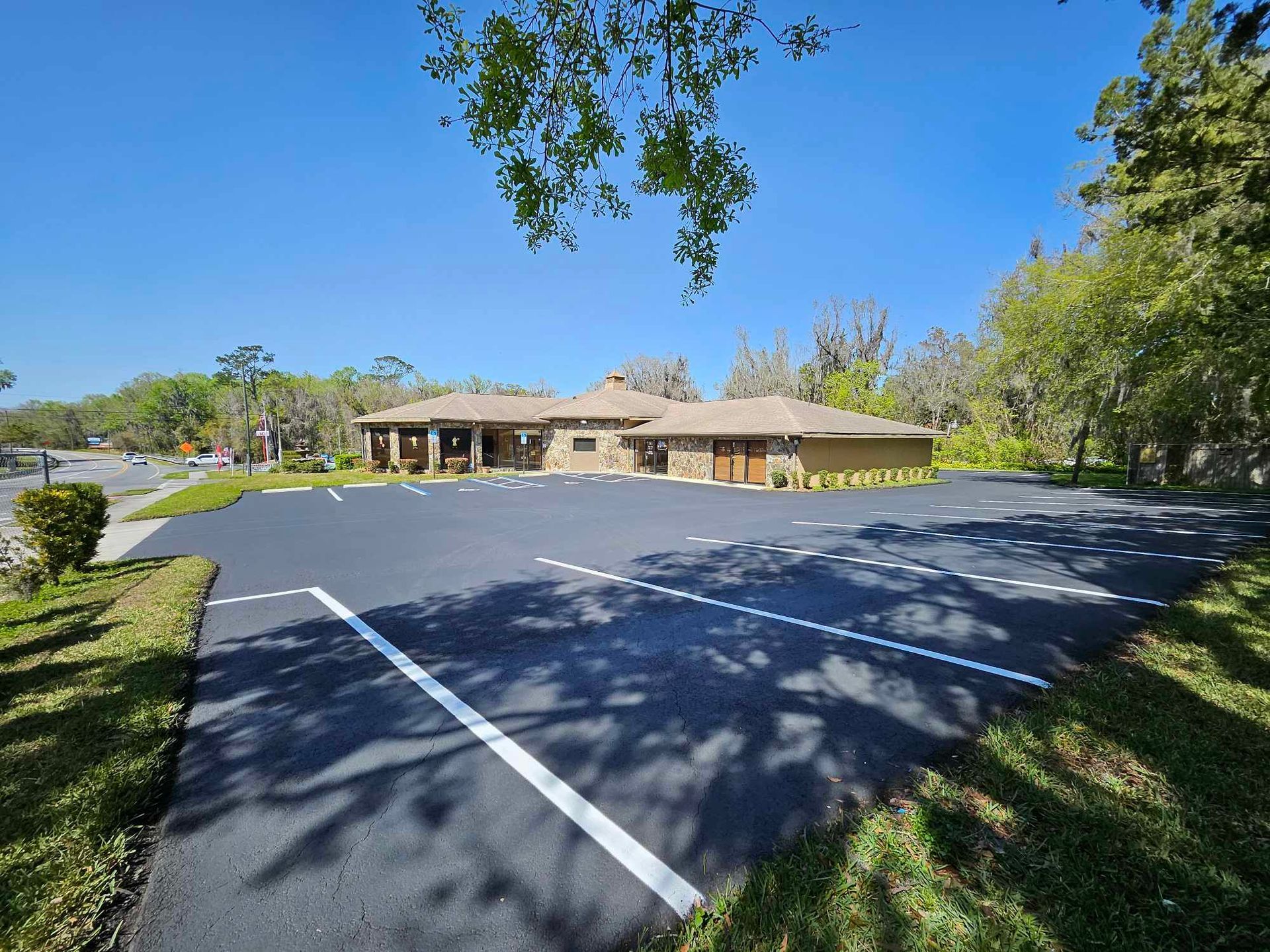 A large building with a parking lot in front of it