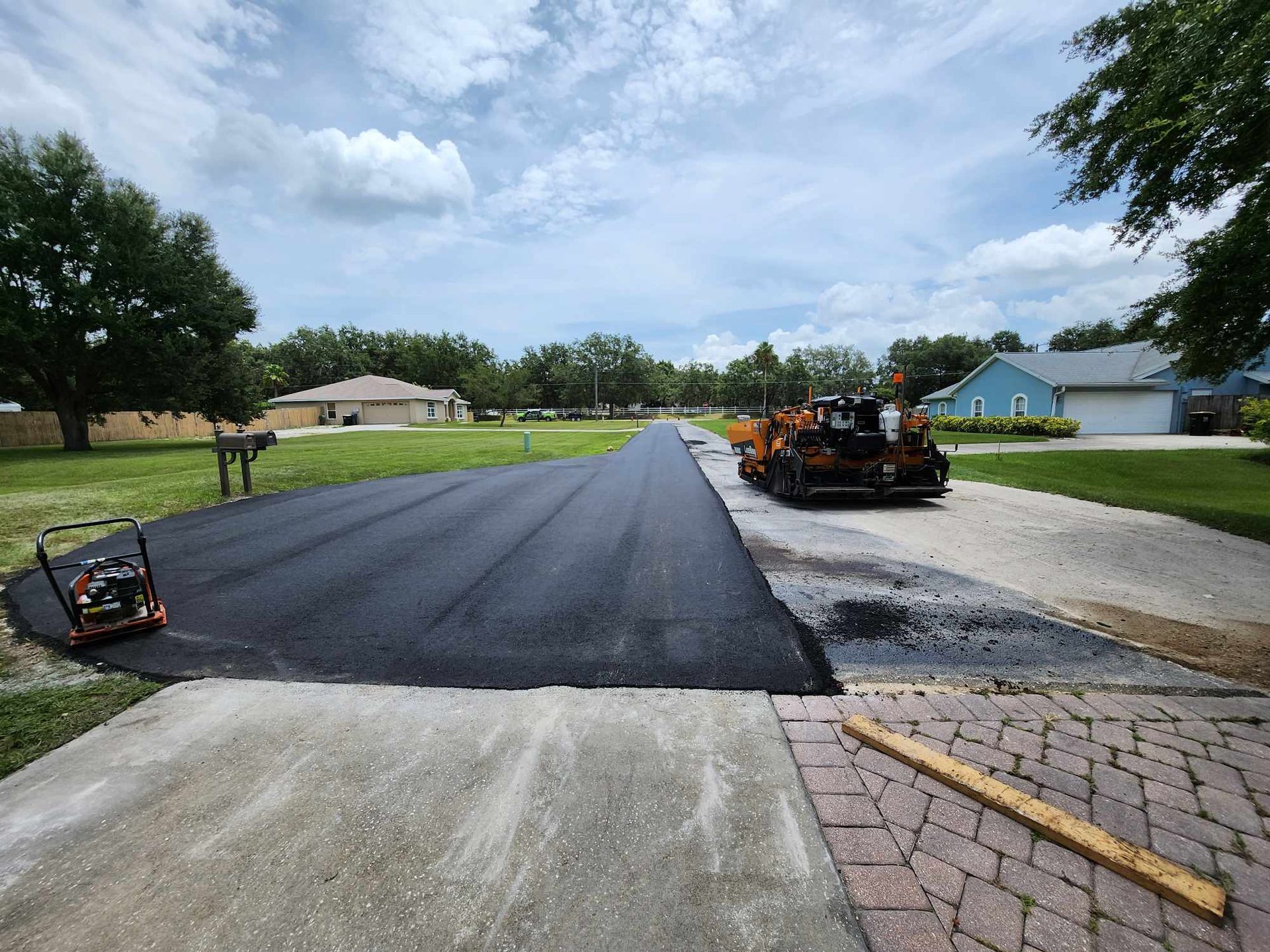 A road is being paved in a residential area