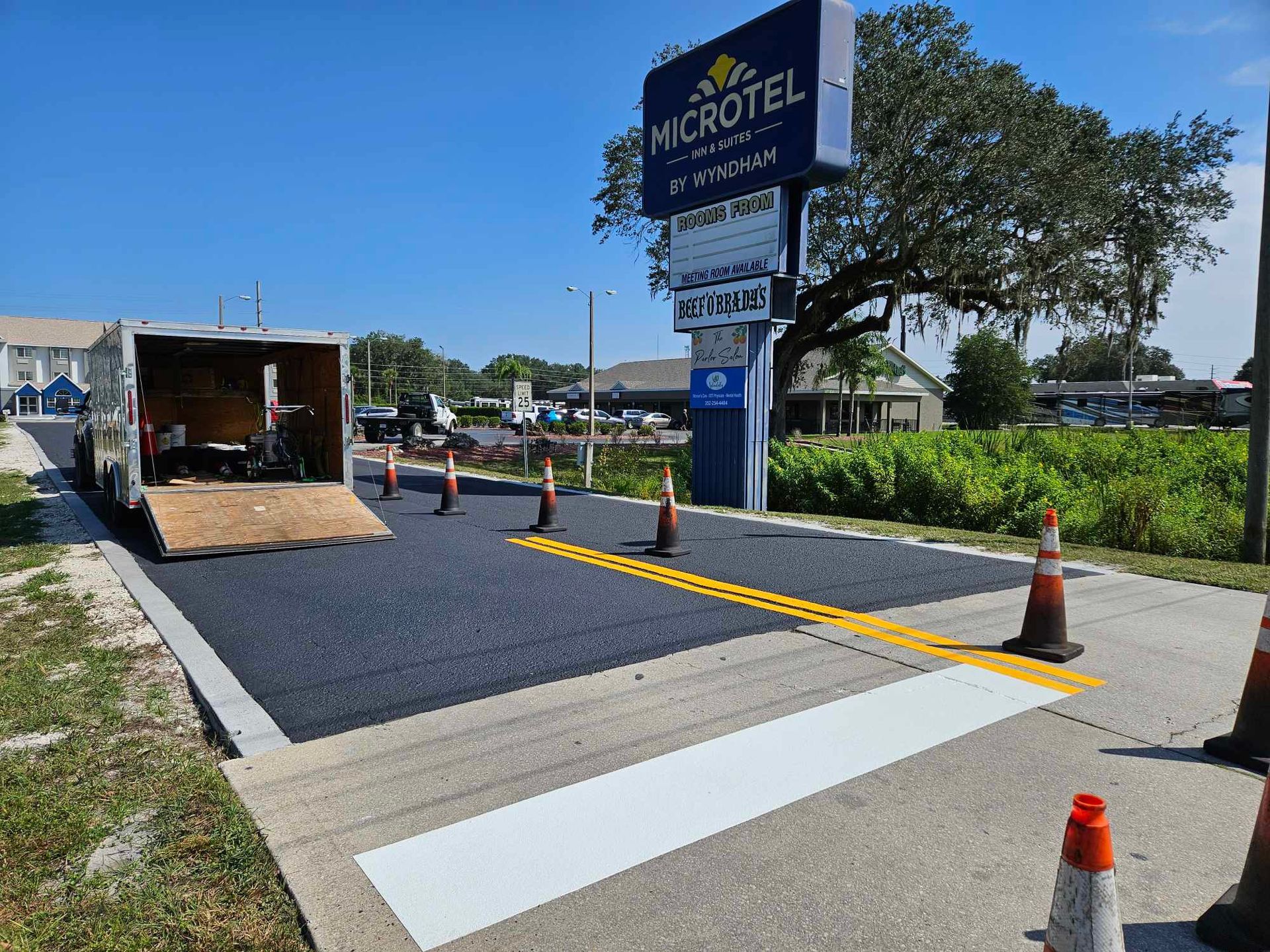 A truck is parked on the side of the road 