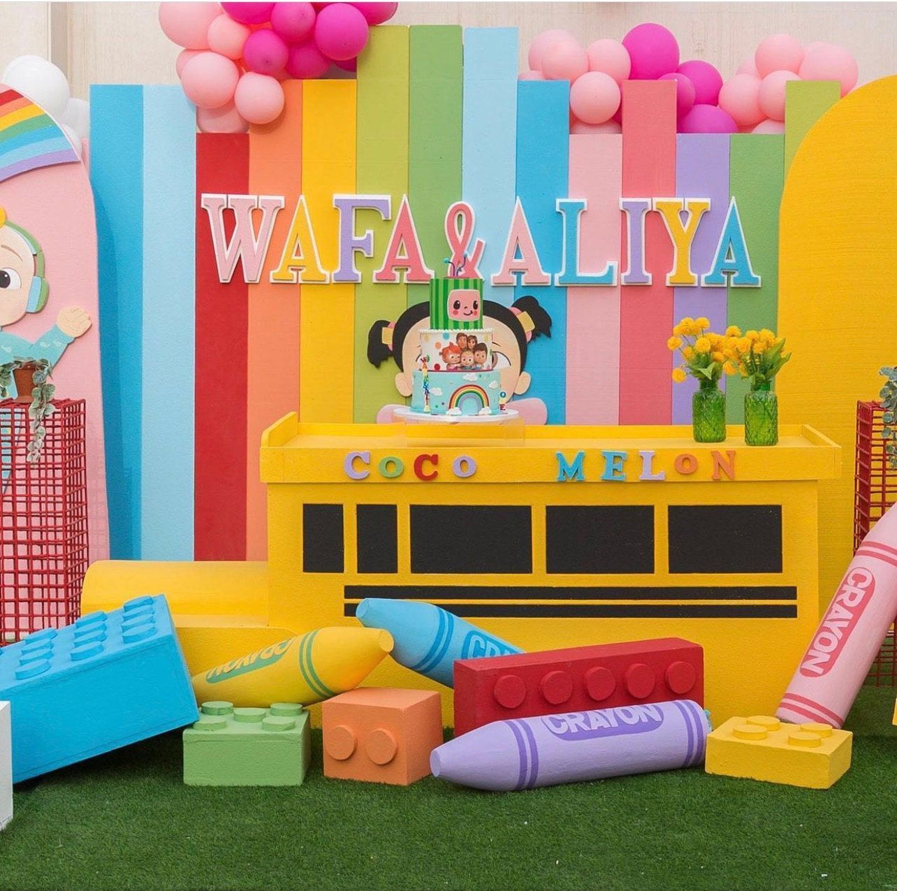 A colorful backdrop with the name wafa & aliya on it