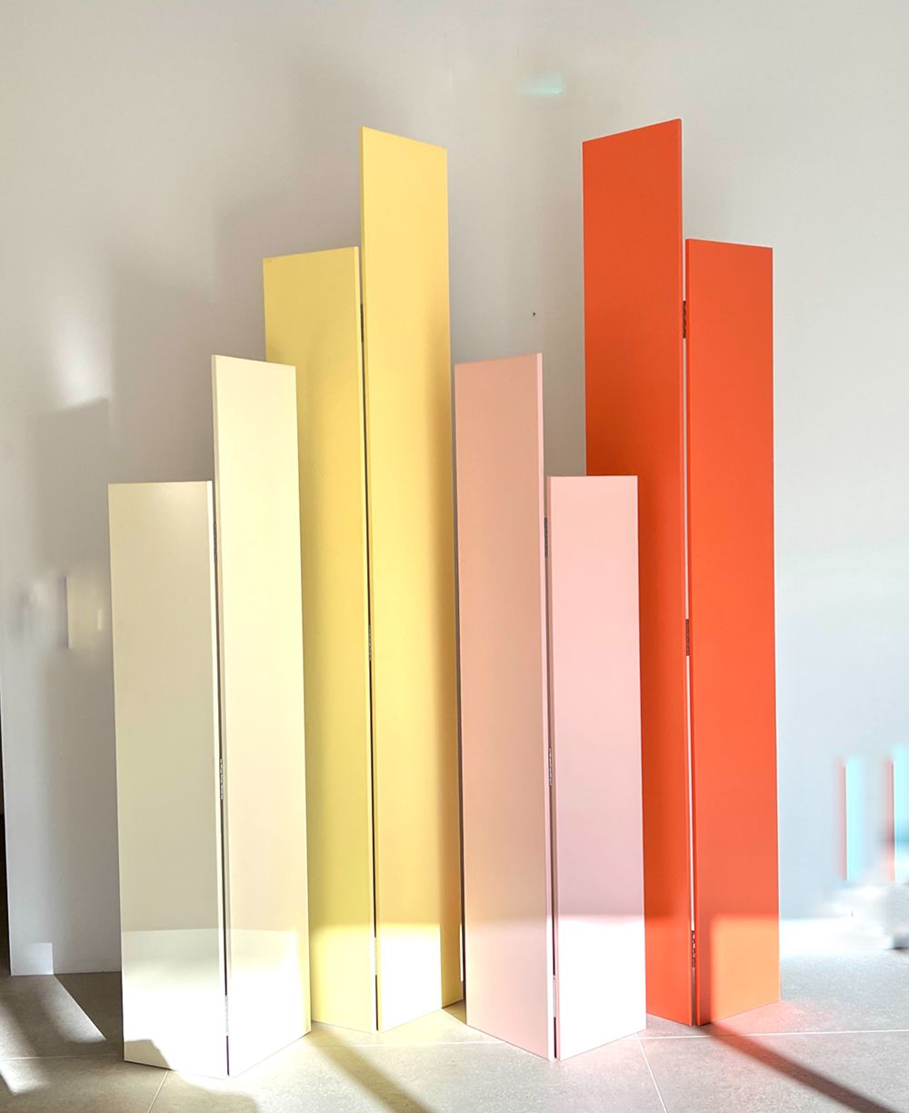 A room with a row of orange and yellow columns