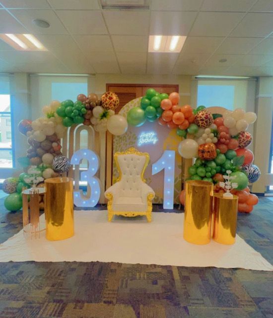 A room filled with balloons and a chair