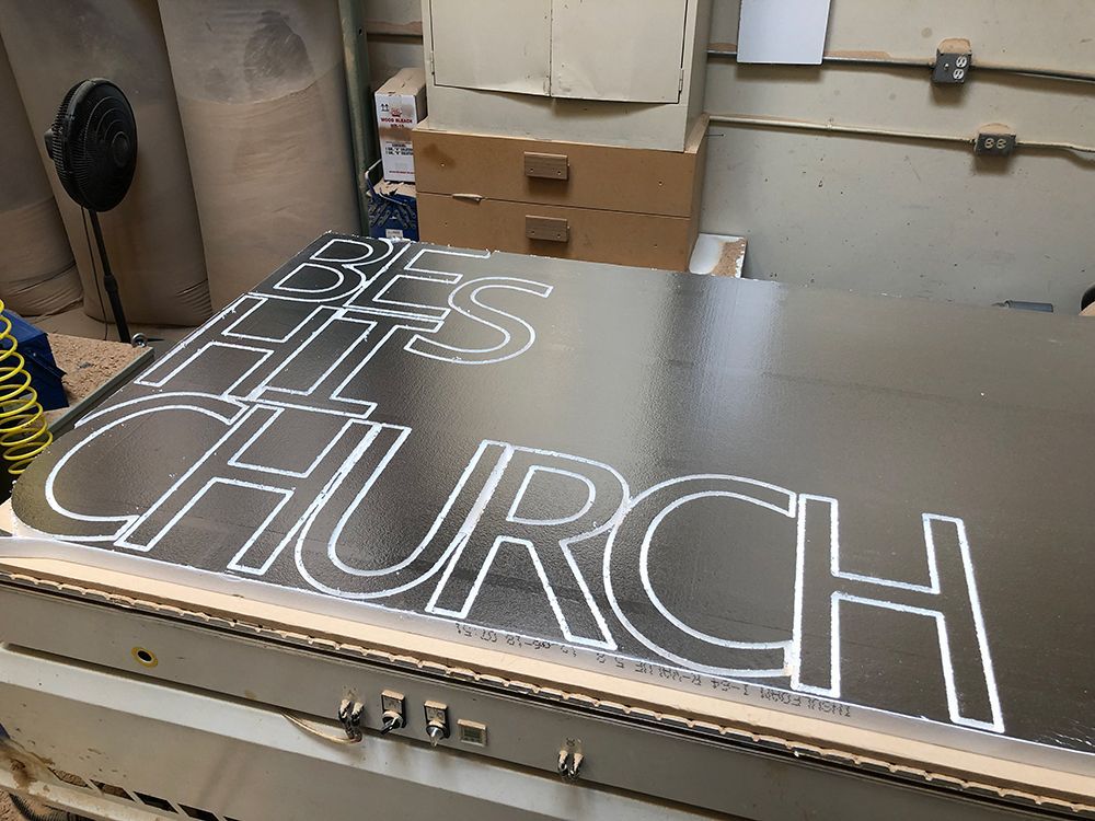 A piece of wood with the word church written on it