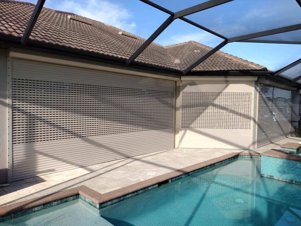 A house with a swimming pool in front of it