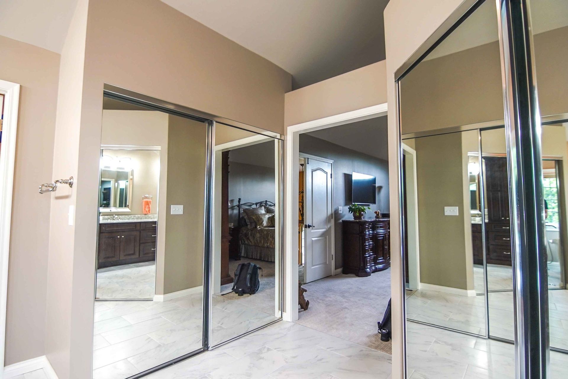 A room with a lot of mirrors on the wall.