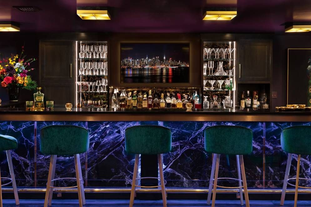 A bar with a lot of bottles of alcohol on it