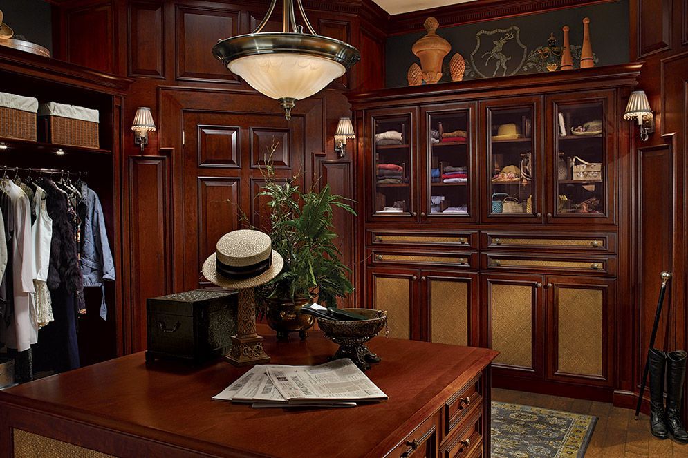 A closet with a table and a hat on it