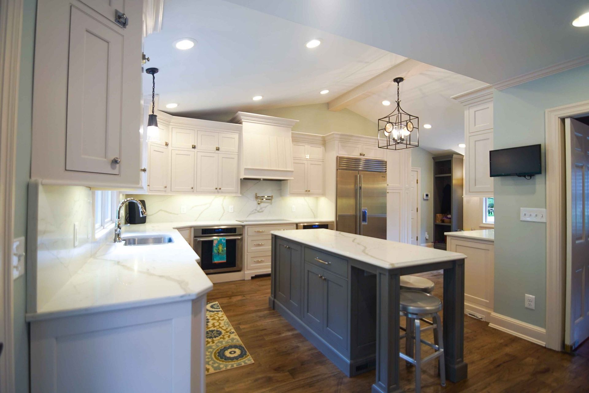 There is a large island in the middle of the kitchen.