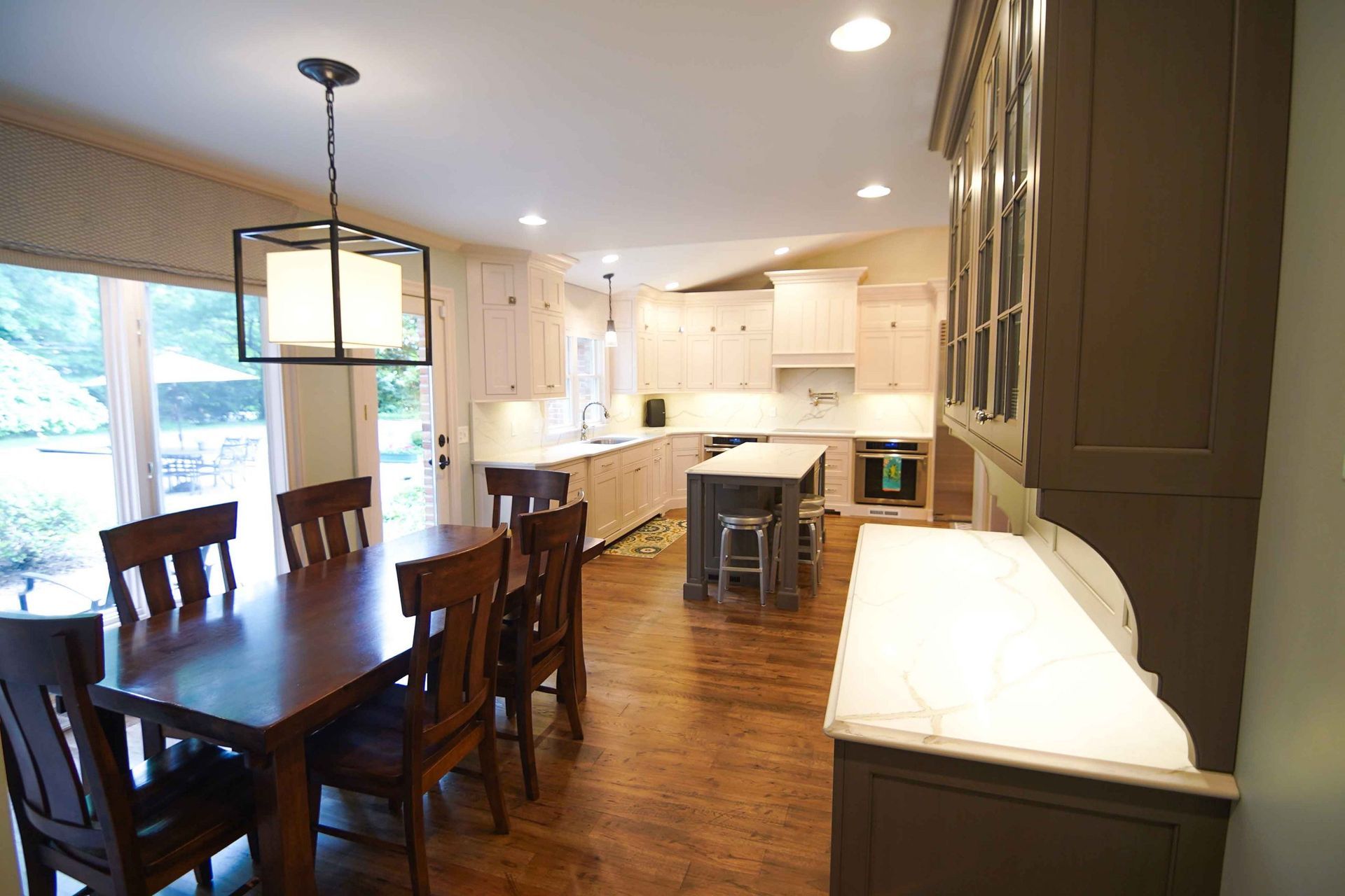 A kitchen with a table and chairs in it