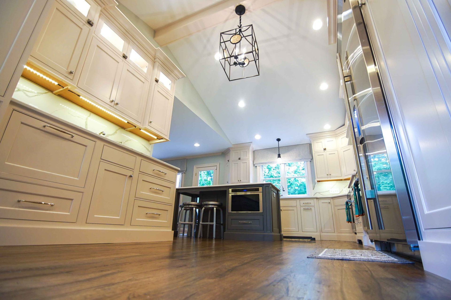 A kitchen with white cabinets and stainless steel appliances.