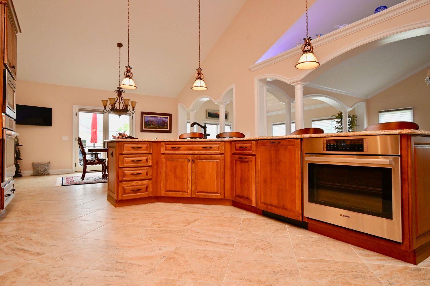 A kitchen with wooden cabinets and stainless steel appliances