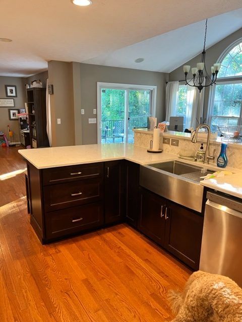 A kitchen with stainless steel appliances and a sink