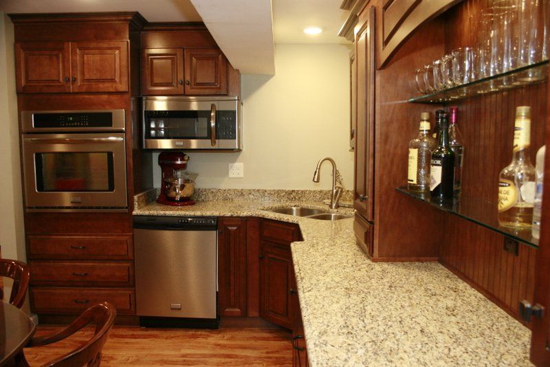 A kitchen with stainless steel appliances and granite counter tops