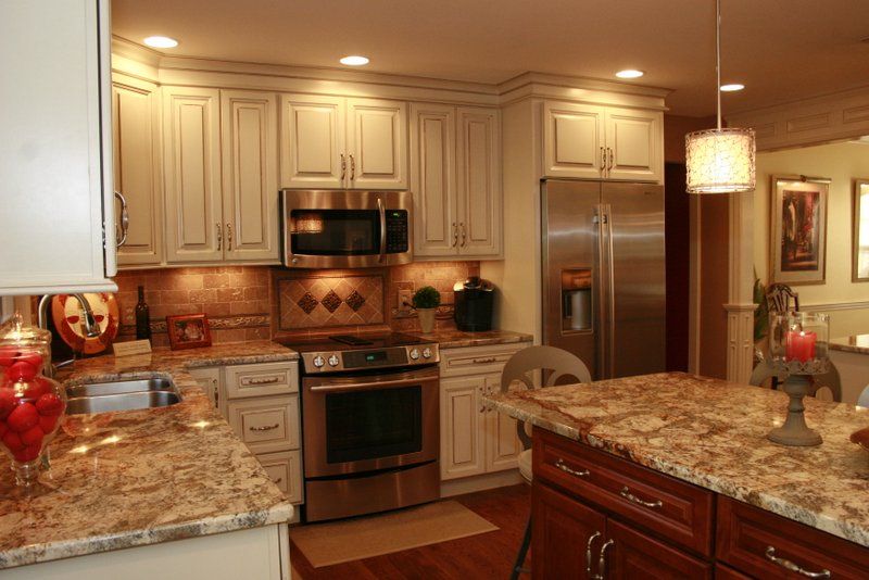 A kitchen with stainless steel appliances and granite counter tops