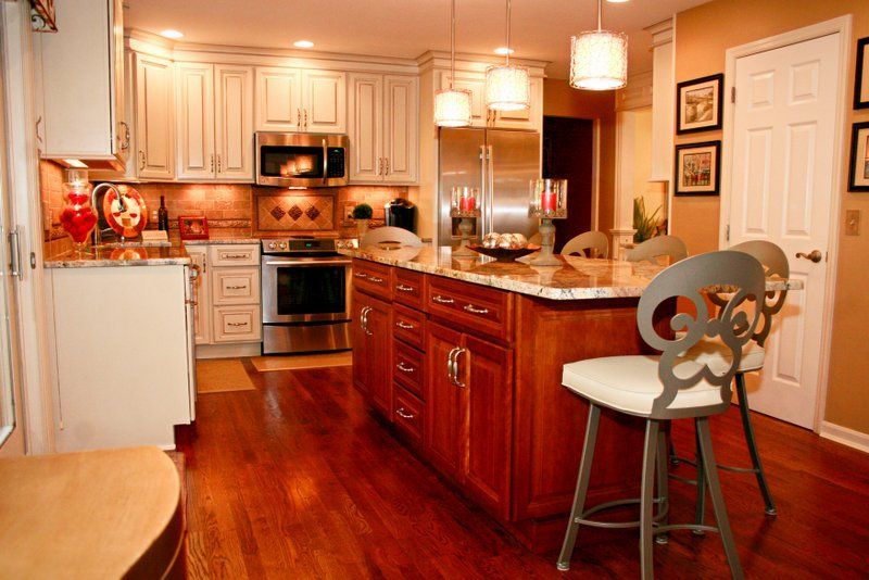 A kitchen with stainless steel appliances and wooden cabinets