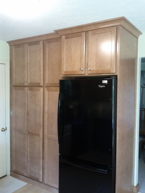 A black whirlpool refrigerator in a kitchen