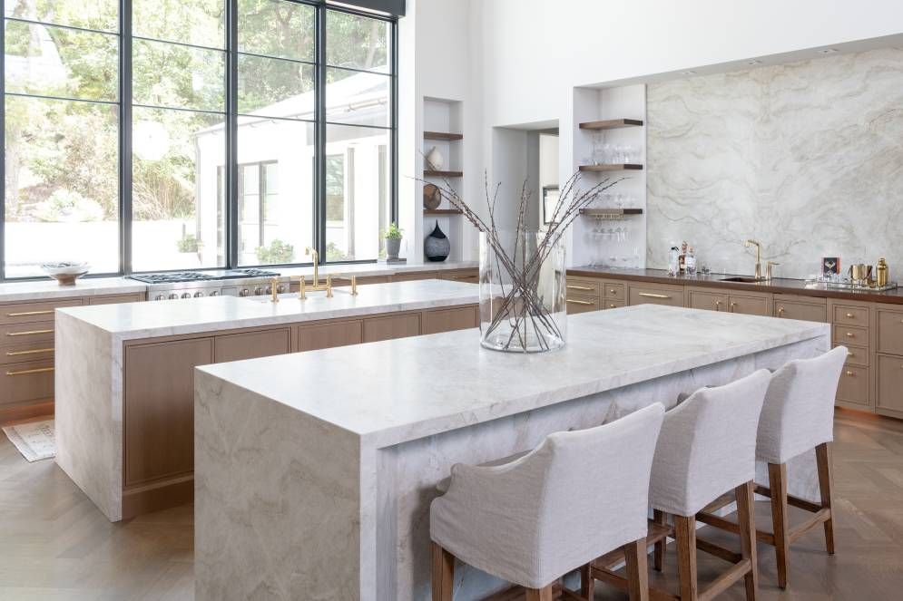 There is a large island in the middle of the kitchen.