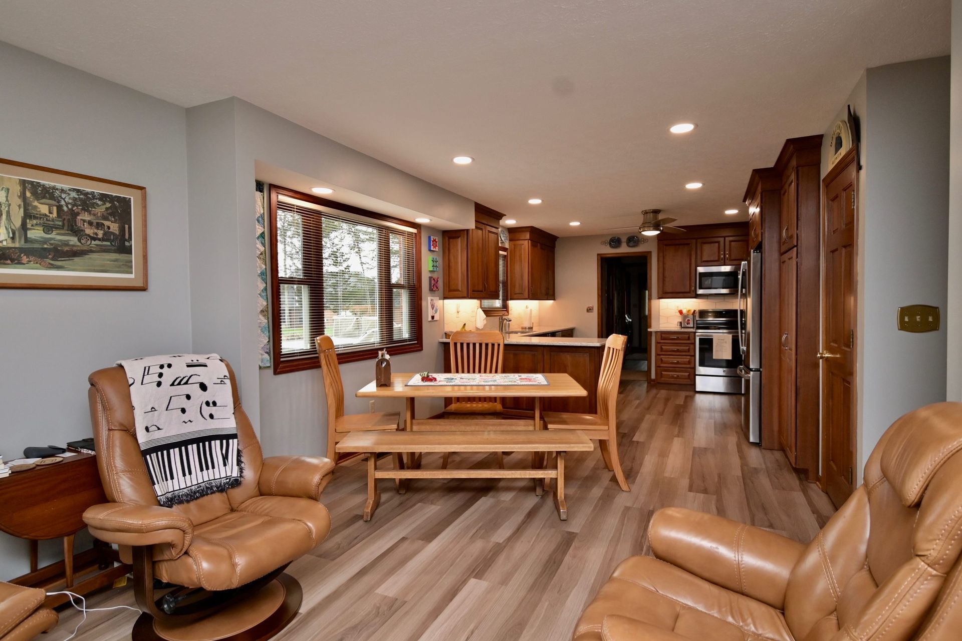 A living room with a chair and a table in it