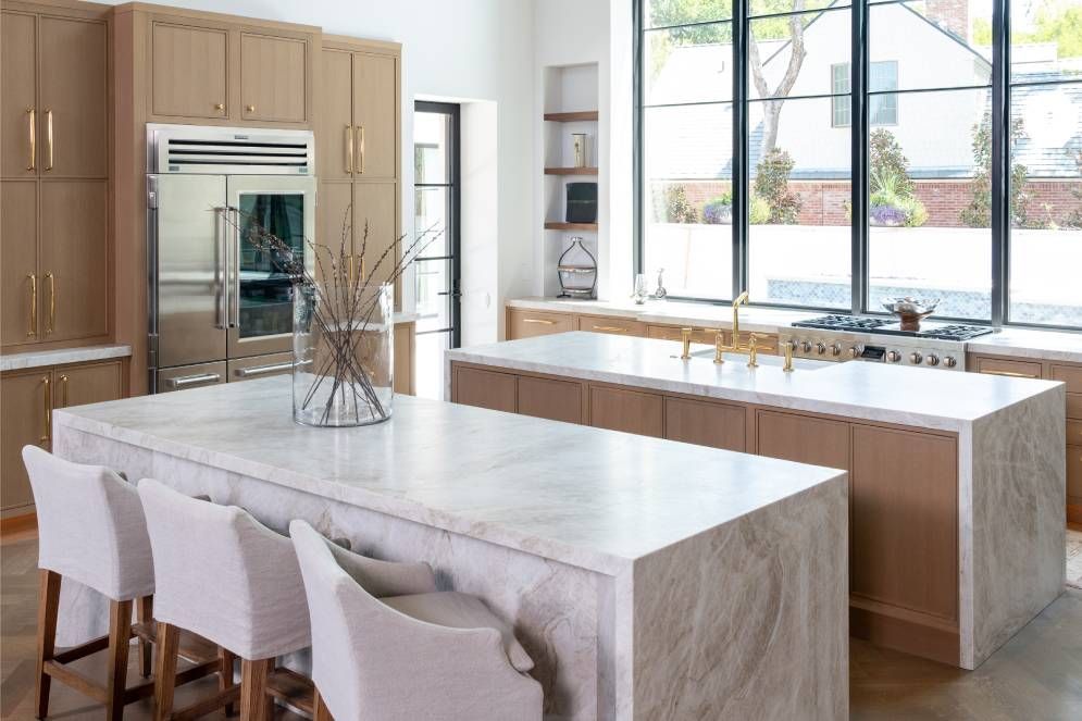 There is a large island in the middle of the kitchen.