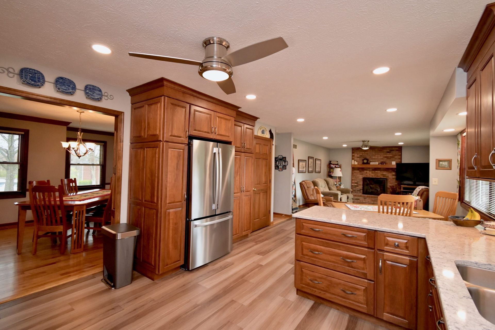 A kitchen with stainless steel appliances and wooden cabinets