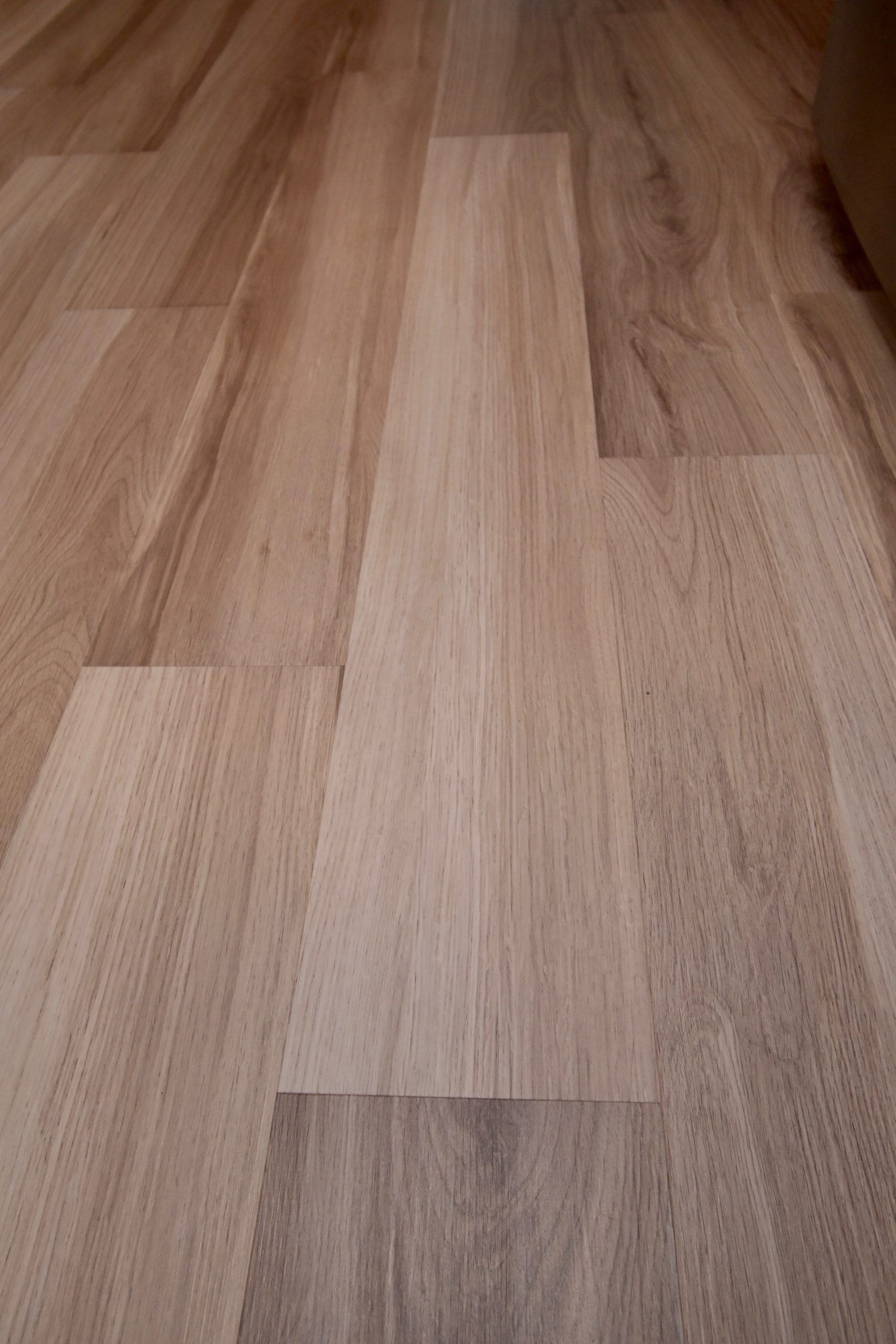 A close up of a wooden floor in a room.