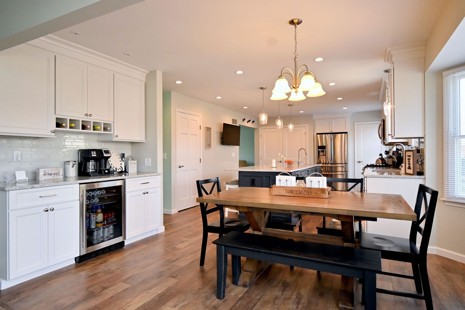 A kitchen with a table and chairs in it