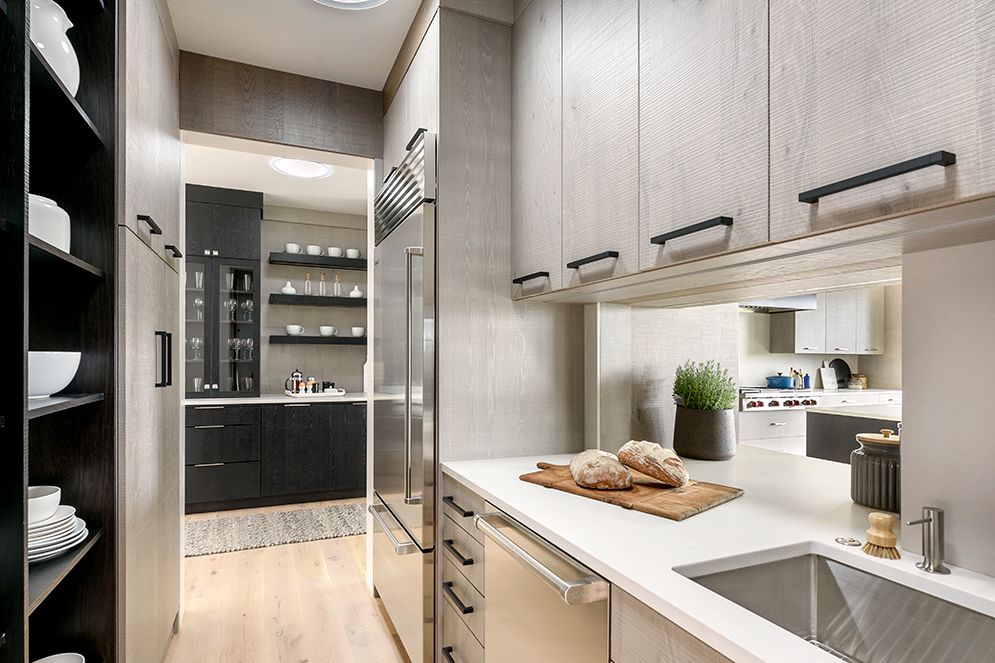 A kitchen with stainless steel appliances and a sink.