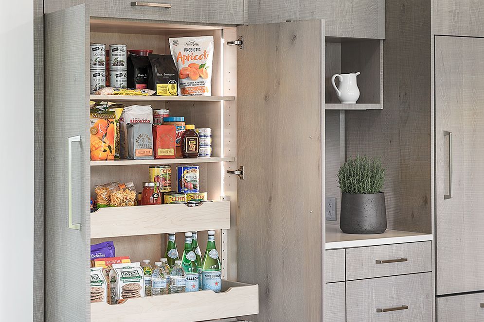 A kitchen pantry filled with lots of food and drinks.