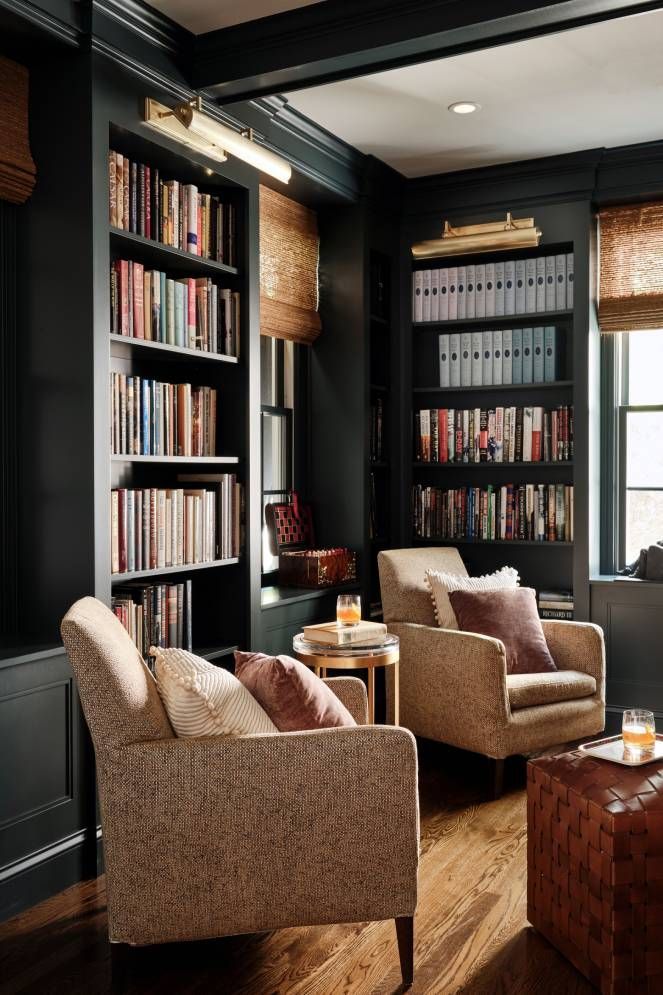 A living room filled with furniture and bookshelves