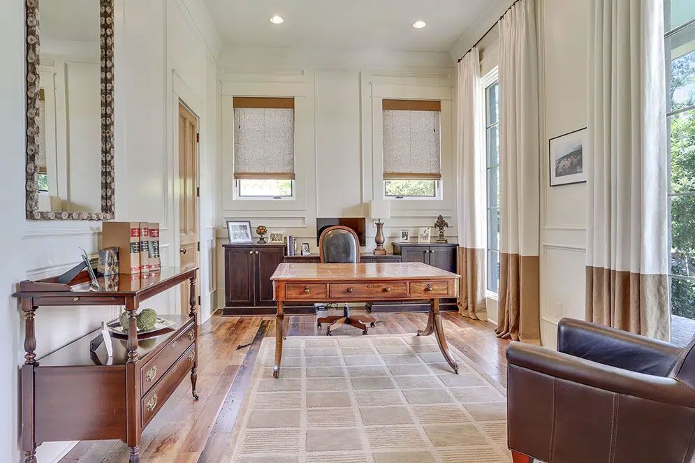 There is a desk in the middle of the room.