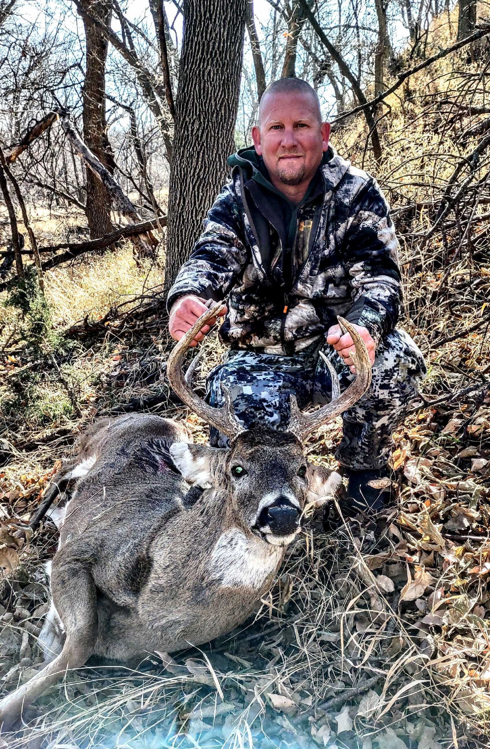 hunter with a dead deer