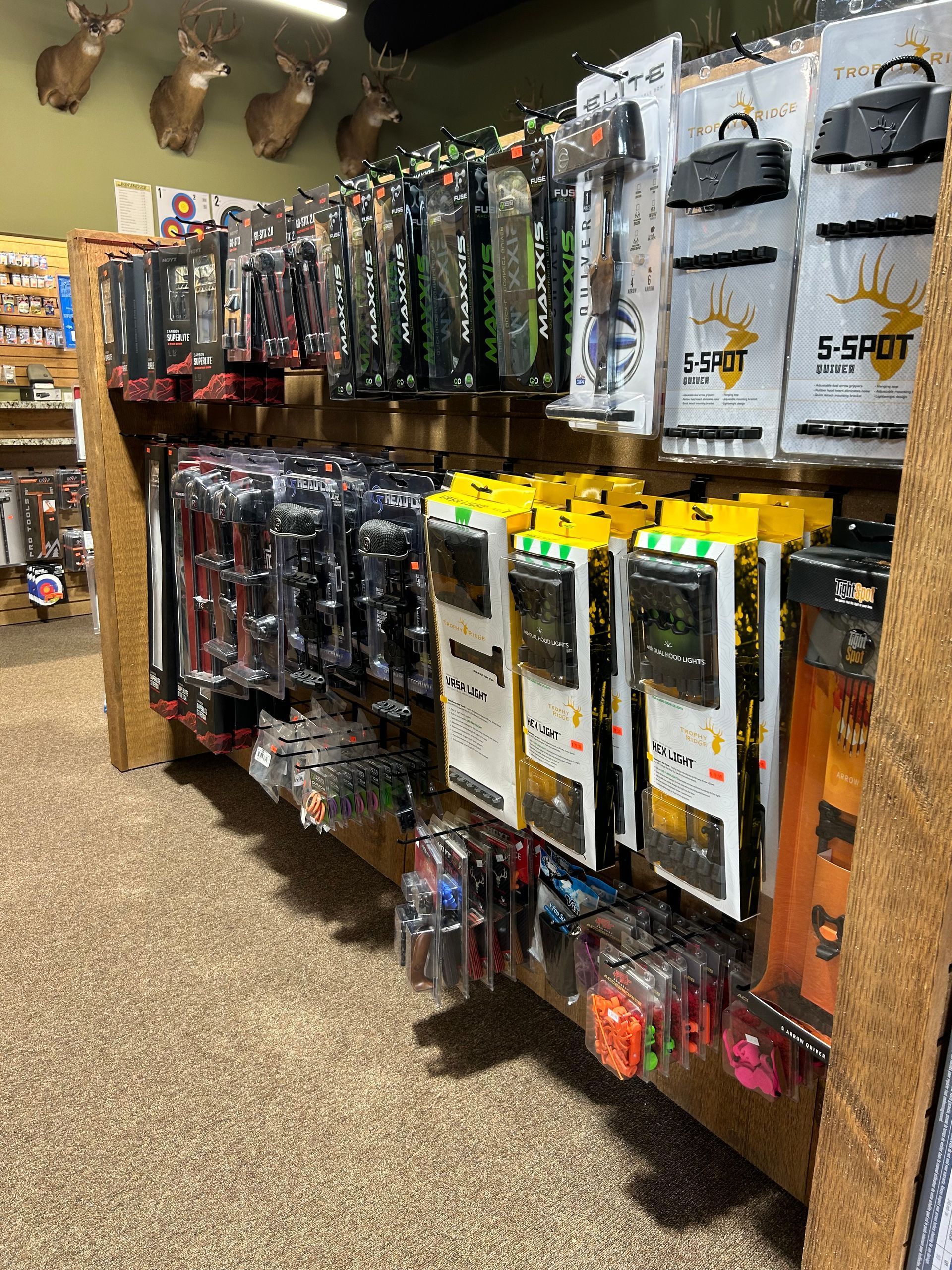 a store filled with lots of different types of archery equipment