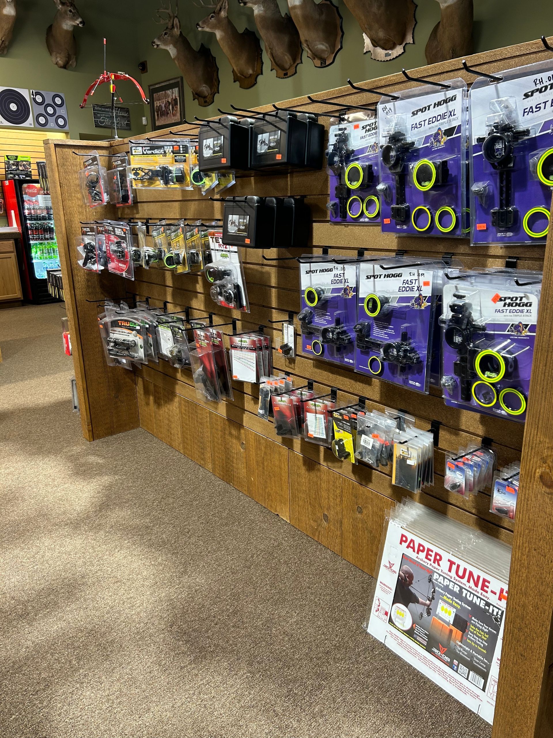 a store filled with lots of different types of hunting equipment