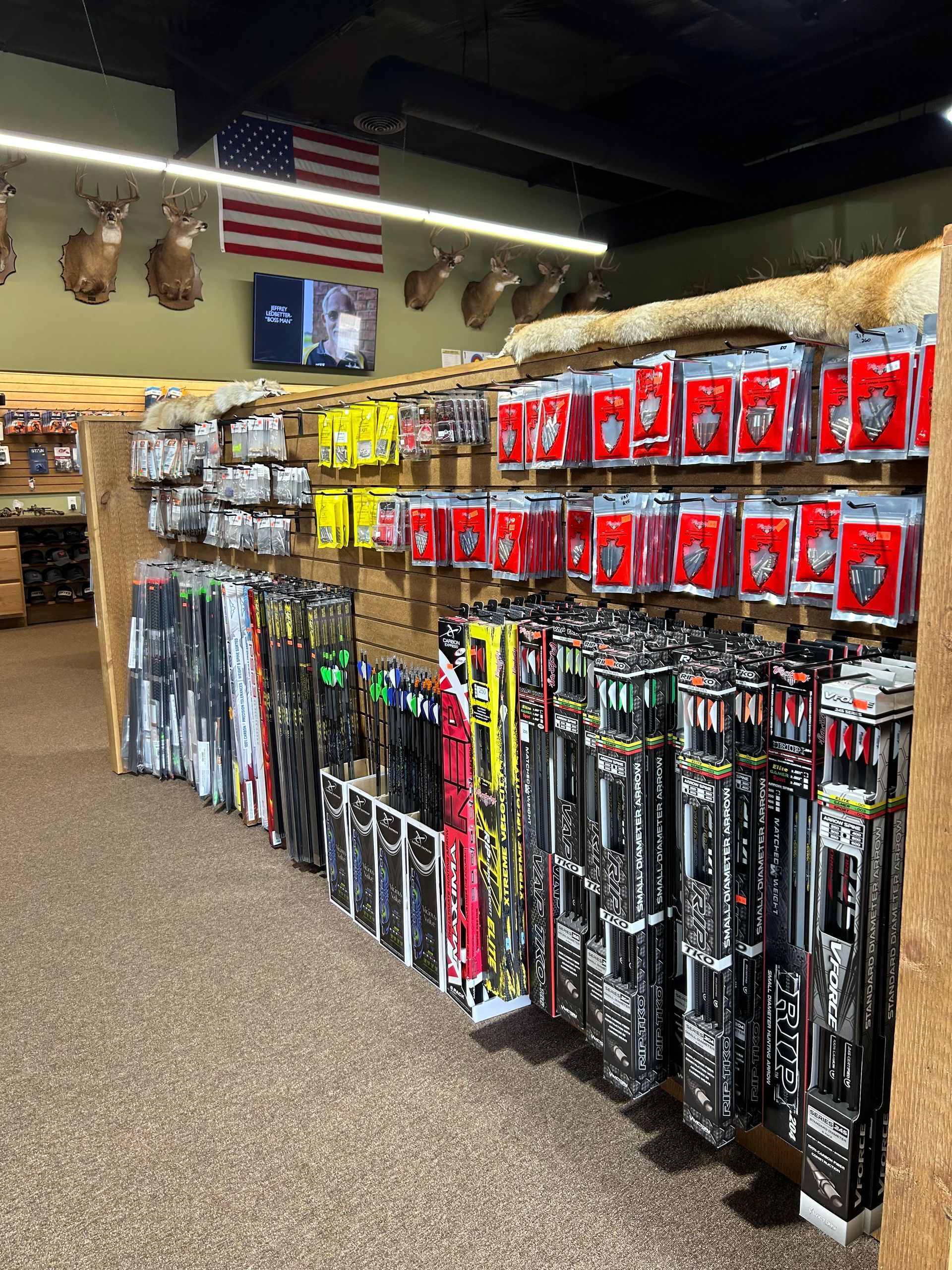a store filled with lots of different types of hunting equipment