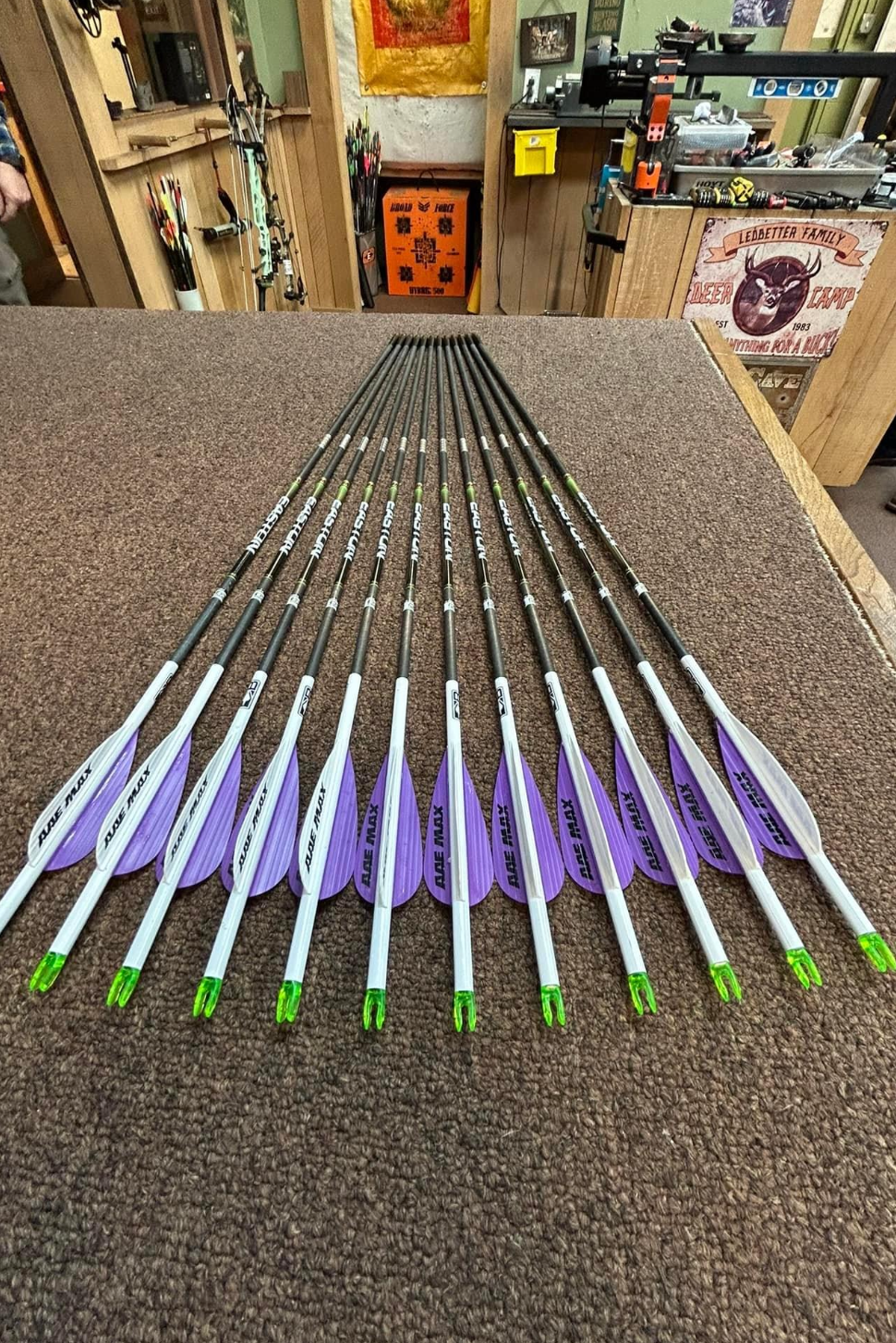 a bunch of arrows are sitting on top of a table