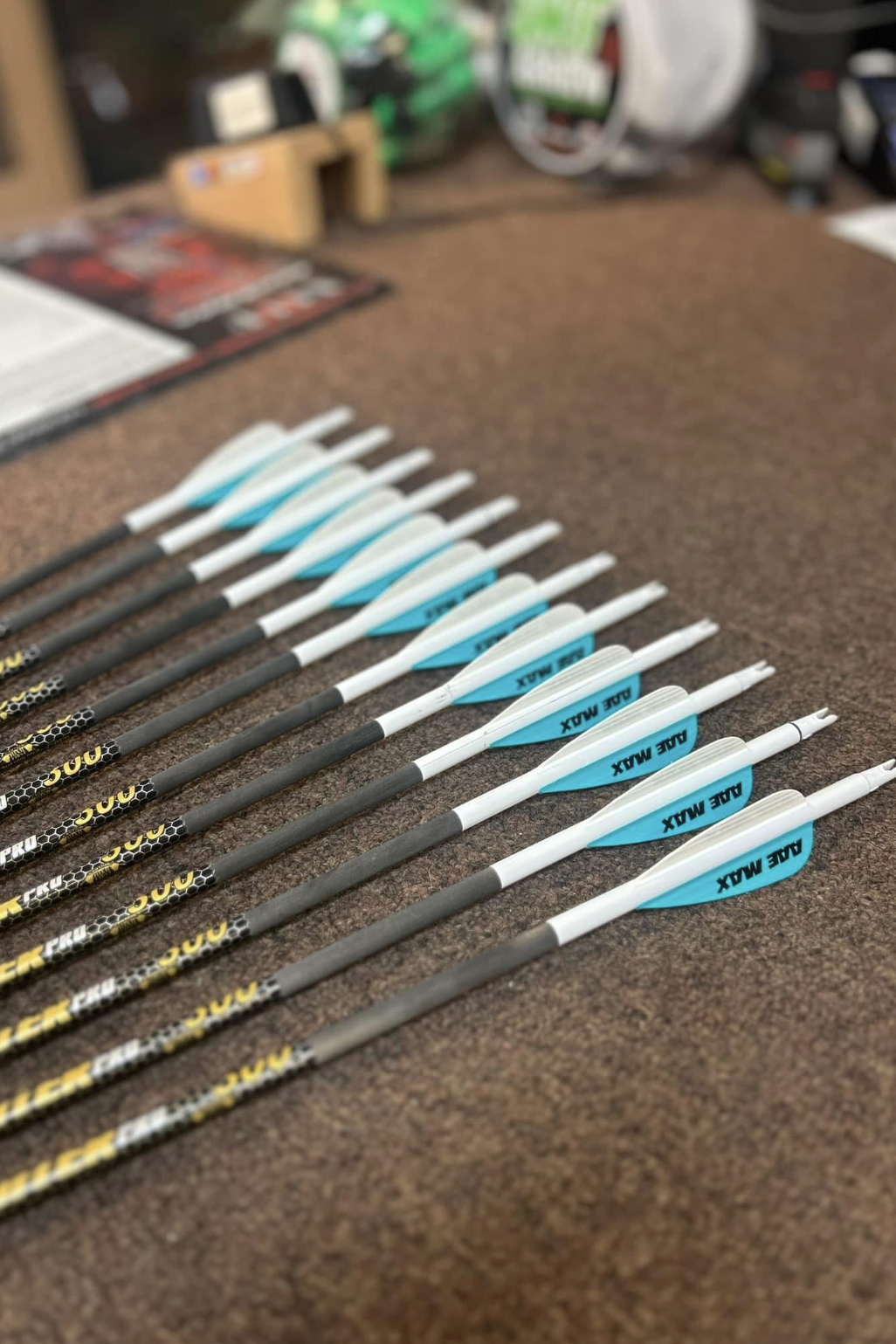 a bunch of arrows are lined up on a table