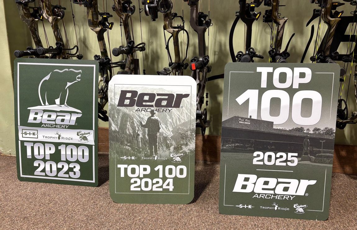 Three Bear Top 100 awards on a counter, labeled 2023, 2024, and 2025.