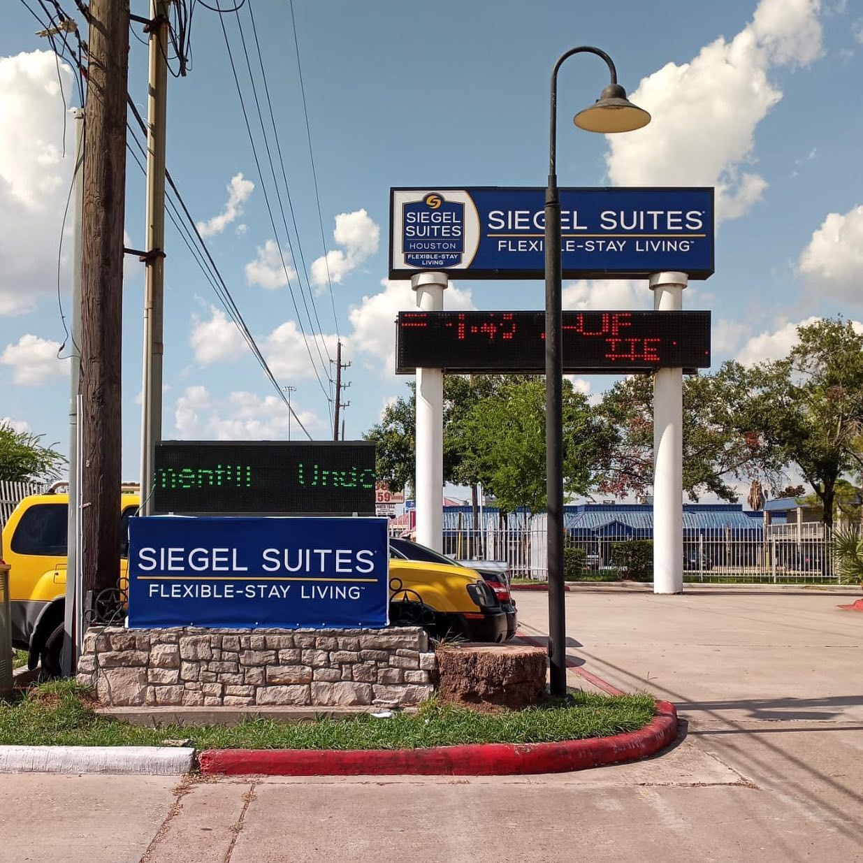A sign that says siegel suites on it